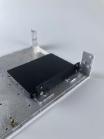 assembly mounted to the enclosure